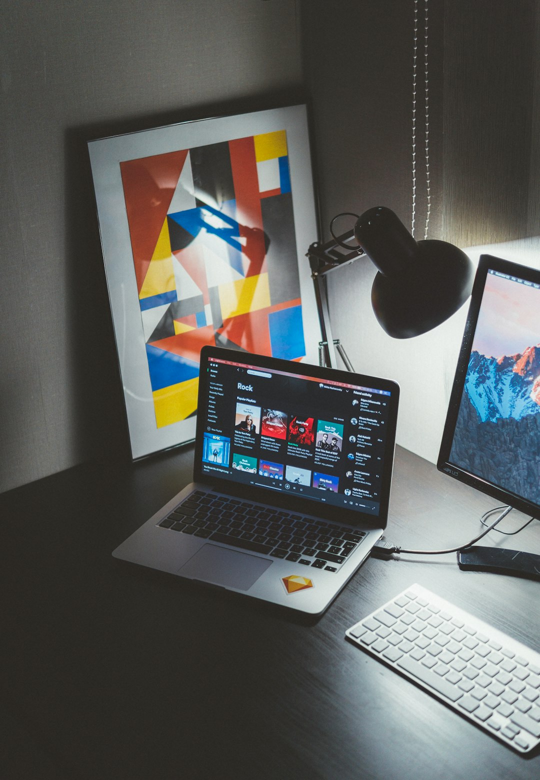 creative-03 turned-on-macbook-on-table-beside-imac-g-yix8ynmny